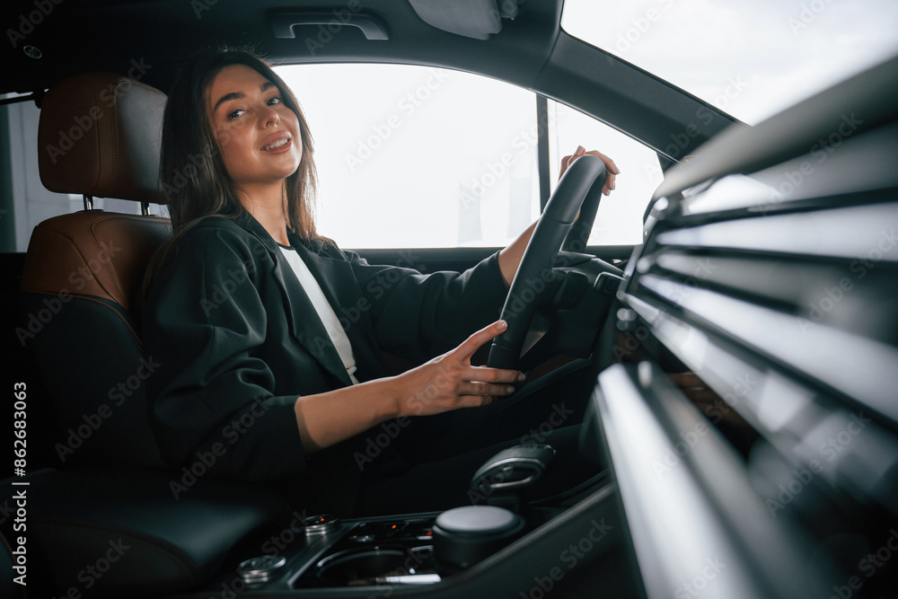 Beautiful businesswoman is in the new car Beautiful businesswoman is in the new car