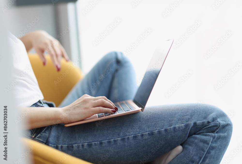 Naklejka premium Female hands on keyboard on laptop. Remote work and freelance concept