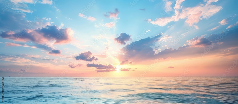 Fototapeta premium Tranquil ocean view at sunset with beautiful cloud formations, perfect for a copy space image.