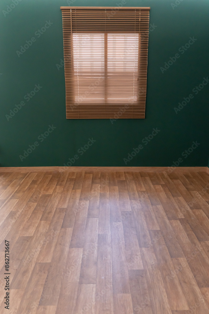 Empty room with wooden flooring, green wall and a window. High quality photo Empty room with wooden flooring, green wall and a window. High quality photo