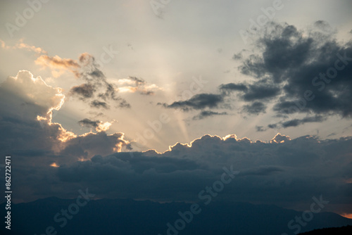 Ray of light through the clouds on the high mountain, beautiful scenery.