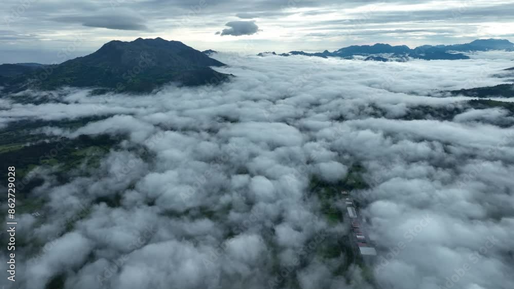 Aerial view of foggy mountain valley in Infiesto, Asturias, Spain. Aerial view of foggy mountain valley in Infiesto, Asturias, Spain.