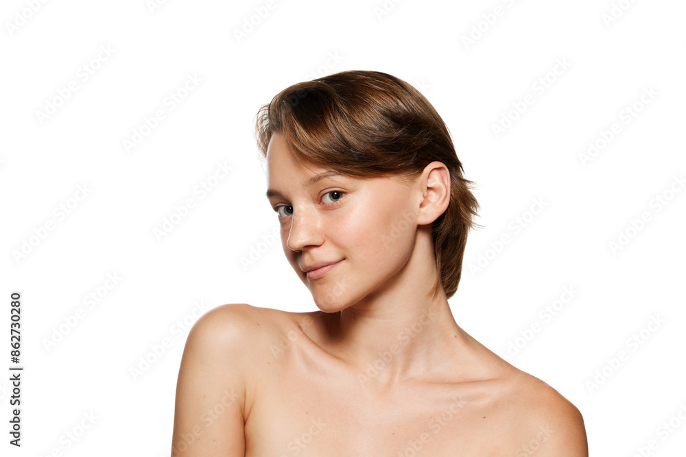 Natural beauty woman with bare shoulders looking at camera with light smile against white studio background. Model with smooth skin. Concept of youth, beauty and fashion, cosmetic product, dermatology Natural beauty woman with bare shoulders looking at camera with light smile against white studio background. Model with smooth skin. Concept of youth, beauty and fashion, cosmetic product, dermatology