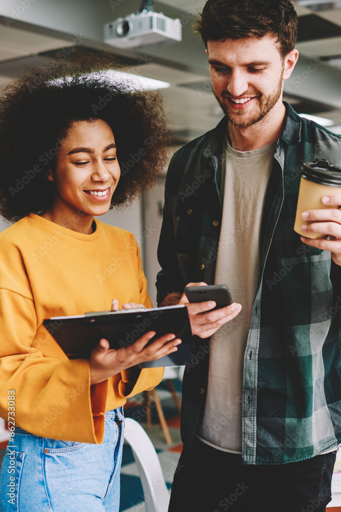 © BullRun - Cropped image of emotional hipster guys laughing while creating new business project plan using application on smartphone.Cheerful male and female employees having fun during collaborating together © BullRun - Cropped image of emotional hipster guys laughing while creating new business project plan using application on smartphone.Cheerful male and female employees having fun during collaborating together