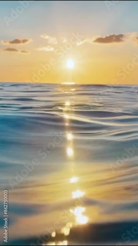 clean blue sea water line and underwater view with rays of sunset or sunrise light - 4k 9x16 vertical new stock video footage animation AI