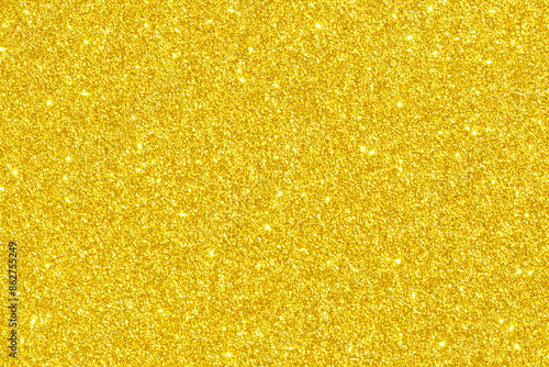 Golden yellow glitter light shiny texture background. New Year, Christmas, Wedding, Anniversary and Celebration background concept. 
