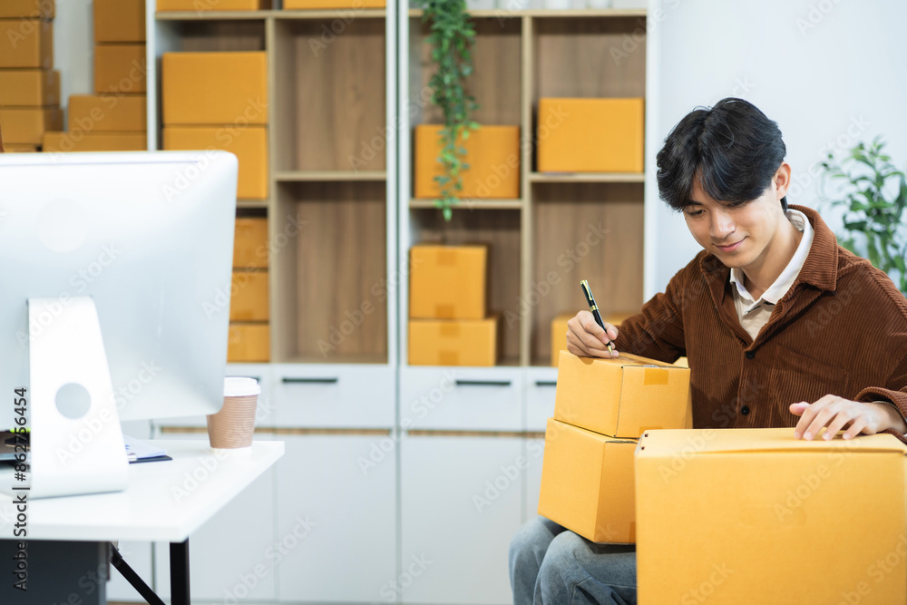 Young couple start up online seller owner at workplace. small business entrepreneur SME or freelance asian couple working at home. Young couple start up online seller owner at workplace. small business entrepreneur SME or freelance asian couple working at home.