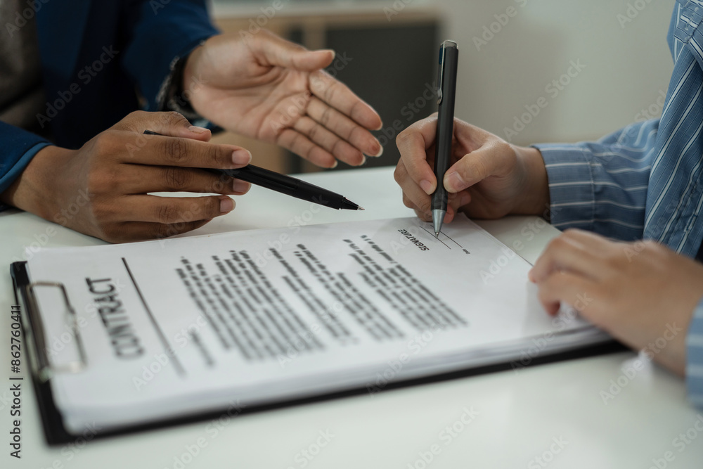 Considering buying a home, investing in real estate. Broker signs a sales agreement. agent, lease agreement, successful deal. Considering buying a home, investing in real estate. Broker signs a sales agreement. agent, lease agreement, successful deal.