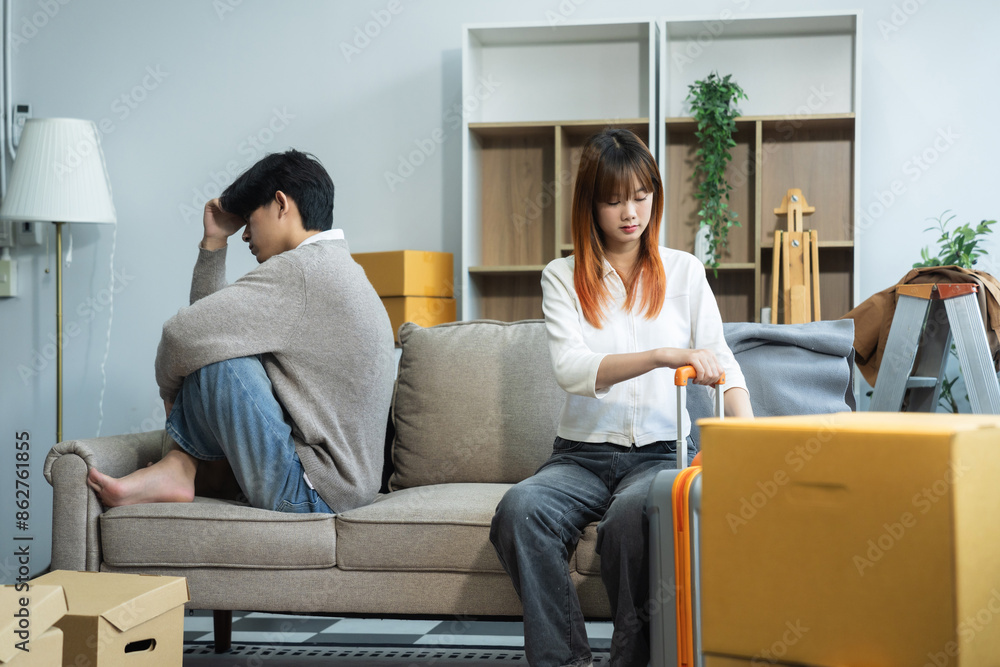 Unhappy young couple sitting apart, having problems in relationship, thinking of breaking up or divorce, upset, family lovers, man and woman avoid talking in relationship problems. Unhappy young couple sitting apart, having problems in relationship, thinking of breaking up or divorce, upset, family lovers, man and woman avoid talking in relationship problems.