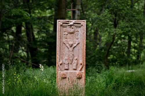 Obraz na płótnie Ancient folk sculpture of the crucifixion of Jesus Christ in the middle of the wood. Contrada Covel, Velo Veronese, Lessinia, Veneto, Italy. w salonie