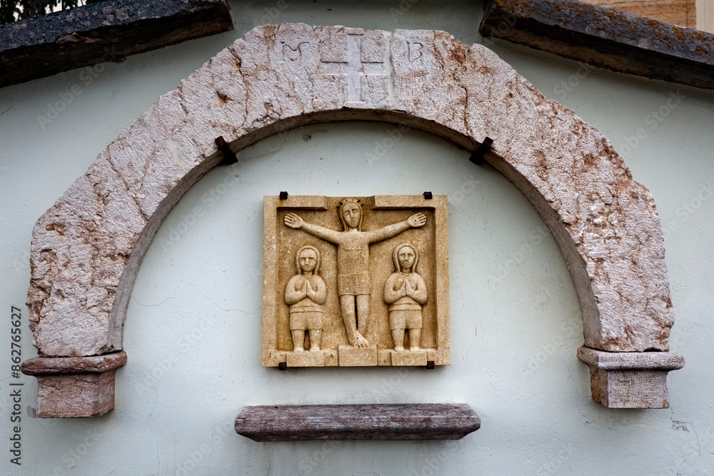 Valdiporro: ancient folk sculpture of the crucifixion of Jesus Christ at the church of Sant'Antonio Abate. Bosco Chiesanuova, Lessinia, Veneto, Italy.