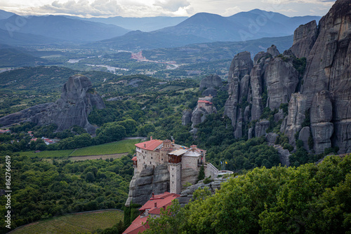 Wallpaper Mural Stunning view from above of the monastery castle built on top of a cliff. Monastery of St. Barbara in Meteora, during sunset. 
Kalambaka. Greece. UNESCO World Heritage Site.
 Torontodigital.ca