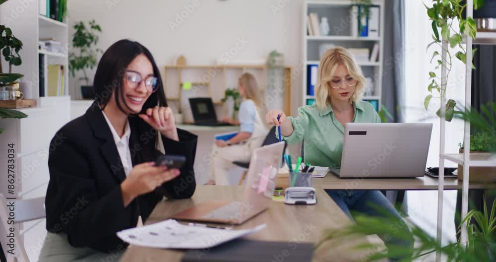 Female Office Worker on Phone with Client Female Office Worker on Phone with Client