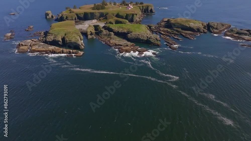 Aerial view of rocky cliffs and waves at Cape Flattery Lighthouse, Pacific Ocean, Washington, United States. photo
