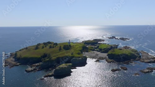 Aerial view of rocky shore and Cape Flattery Lighthouse, Pacific Ocean, Strait of Juan de Fuca, Washington, United States. photo