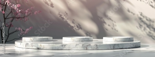 White Marble Product Display Platform With Blossom Branch and Sunlit Shadows