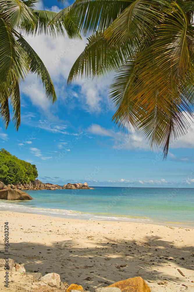 Anse Takamaka, sunny day with blue sky and white sandy beach, turquoise water, Mahe Seychelles Anse Takamaka, sunny day with blue sky and white sandy beach, turquoise water, Mahe Seychelles