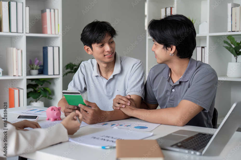 Gay Couple Planning Finance and Investment Together at Home with Documents and Laptop Gay Couple Planning Finance and Investment Together at Home with Documents and Laptop