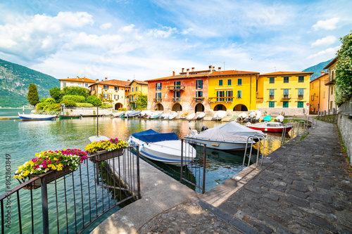 Fototapeta Naklejka Na Ścianę i Meble -  The town of Mandello del Lario, on Lake Como, the small port, the houses and the lake.