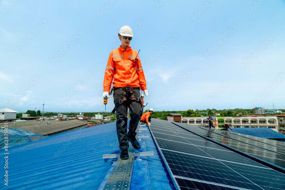 engineer man inspects construction of solar cell panel or photovoltaic cell by electronic device. Industrial Renewable energy of green power. factory worker working on tower roof. engineer man inspects construction of solar cell panel or photovoltaic cell by electronic device. Industrial Renewable energy of green power. factory worker working on tower roof.