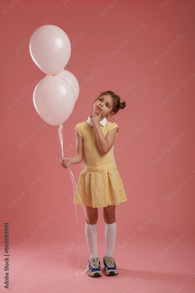 Bunch of balloons, party. Cute little girl is against pink background Bunch of balloons, party. Cute little girl is against pink background