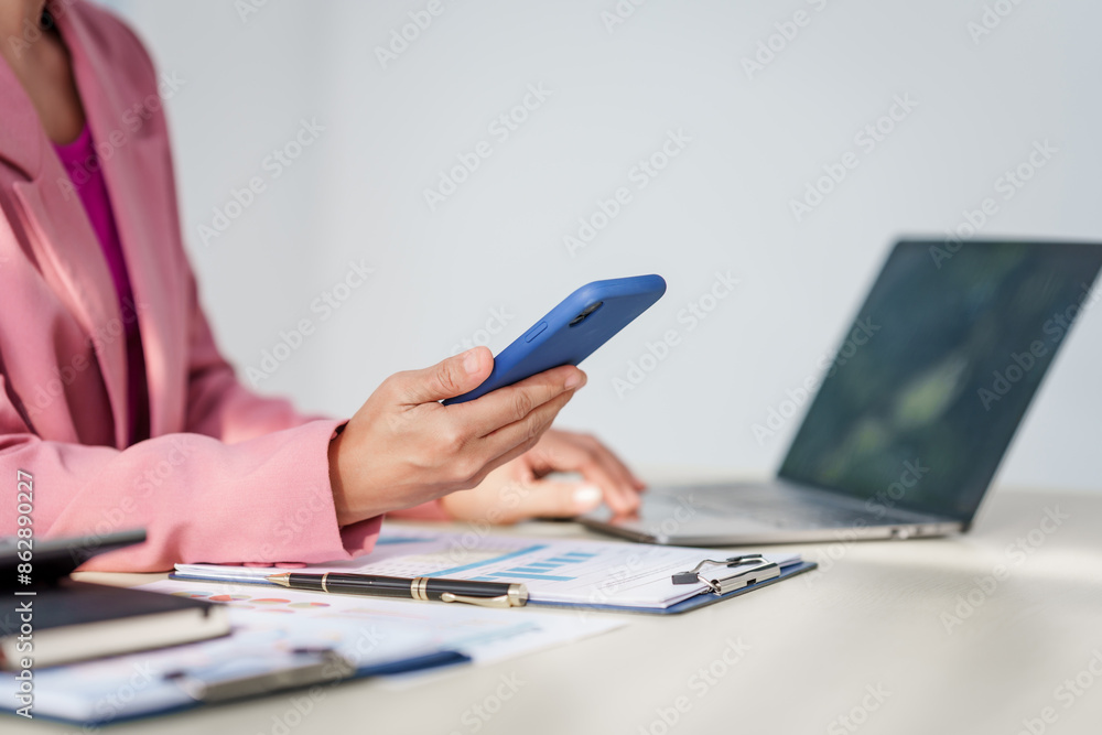 40-year-old middle-aged Asian businesswoman wearing pink suit, business finance, investment strategies, risk management. Skilled in planning, analysis, operations control for business success. 40-year-old middle-aged Asian businesswoman wearing pink suit, business finance, investment strategies, risk management. Skilled in planning, analysis, operations control for business success.