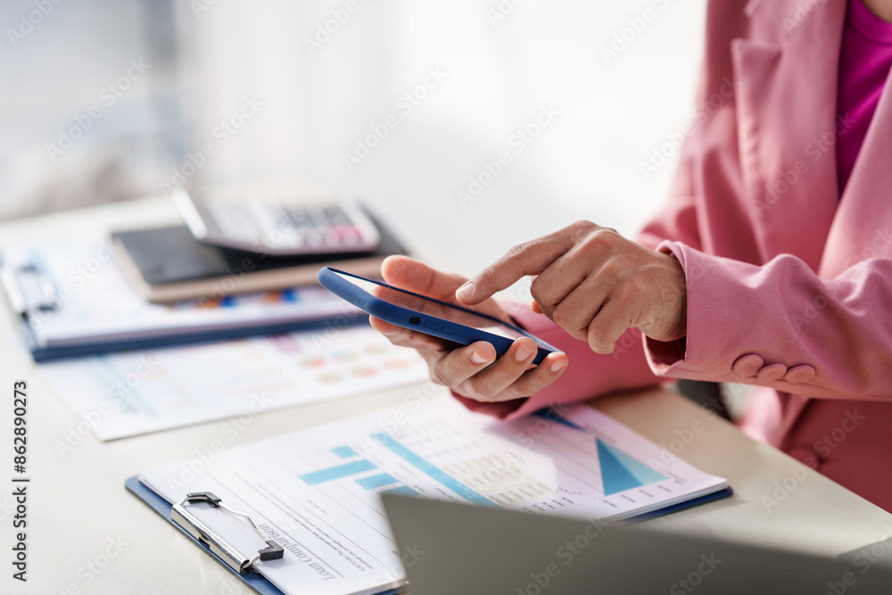 40-year-old middle-aged Asian businesswoman wearing pink suit, business finance, investment strategies, risk management. Skilled in planning, analysis, operations control for business success. 40-year-old middle-aged Asian businesswoman wearing pink suit, business finance, investment strategies, risk management. Skilled in planning, analysis, operations control for business success.