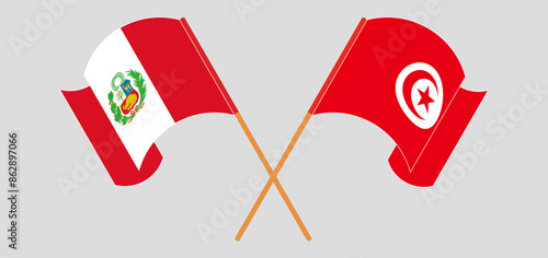 Crossed and waving flags of Peru and Tunisia