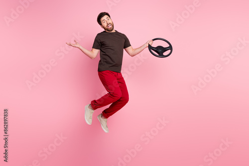 Принти на полотні Full size photo of guilty clueless man wear brown t-shirt hold steering wheel fl