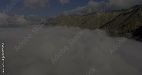 Aerial view of Shandur Lake with majestic mountains and serene clouds, Chitral, Pakistan. photo