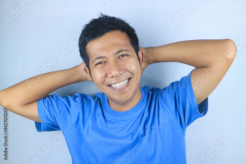 Smiling facial expression young asian man happy looking at camera, isolated on white background photo