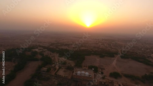 Aerial view of vast desert landscape at sunset in Cholistan Desert, Derawar Fort, Punjab, Pakistan. photo