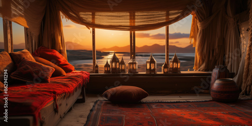 Cozy oriental interior design with beautiful sunset over mountains
