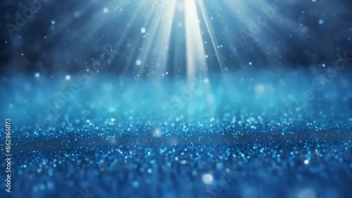 Blue glitter particles falling in light rays loop