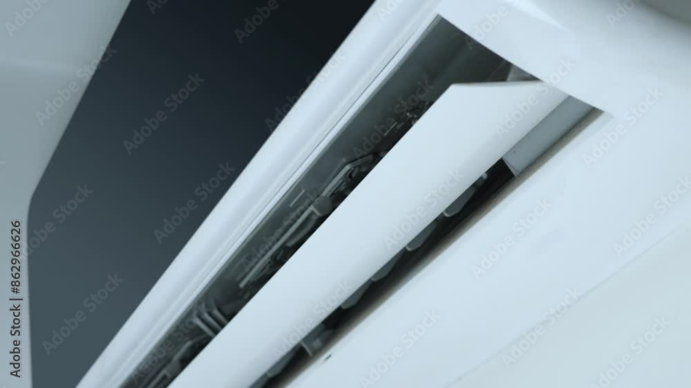 Close-up shot indoor unit air conditioning swinging wing Close-up shot indoor unit air conditioning swinging wing
