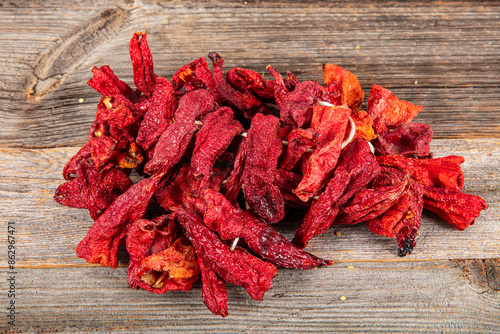 Organic dried sweet bell pepper. Dried peppers hanging in a close-up of a traditional Turkish food market. food background. Local name; Dolmalik Kuru Kapya Biber. photo