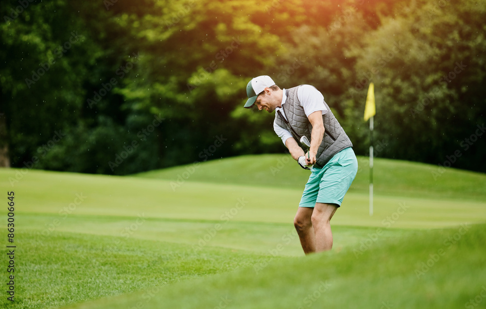 Man, happy and playing golf at field as sports talent or professional skill and training. Hobby, activity and smile with swing at golfing course for tournament or competition and game for fitness Man, happy and playing golf at field as sports talent or professional skill and training. Hobby, activity and smile with swing at golfing course for tournament or competition and game for fitness