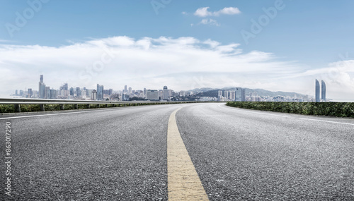Modern Highway Stretching Towards Urban Cityscape