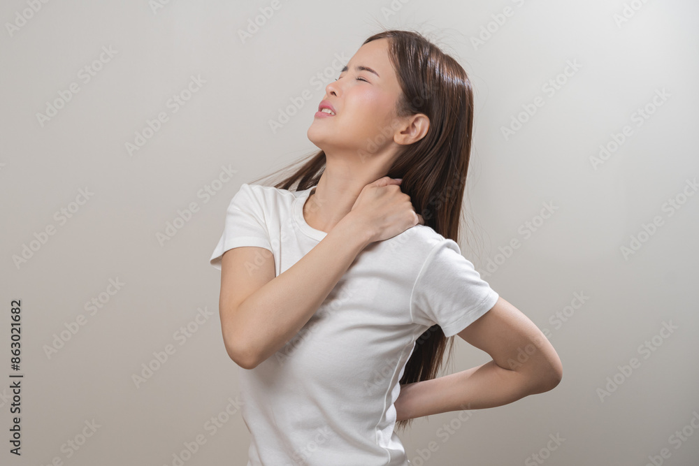 Pain body muscles stiff problem, asian young woman, girl painful with neck pain body ache from work, holding massaging rubbing shoulder hurt, sore on white background. Health care and medicine concept Pain body muscles stiff problem, asian young woman, girl painful with neck pain body ache from work, holding massaging rubbing shoulder hurt, sore on white background. Health care and medicine concept