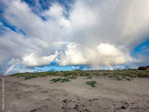 Beautiful rainbow above the dunes in Portnoo, Ireland