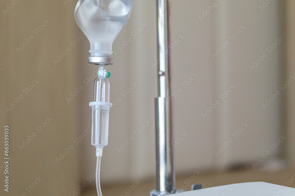 Close up medical intravenous IV drip in hospital background Close up medical intravenous IV drip in hospital background