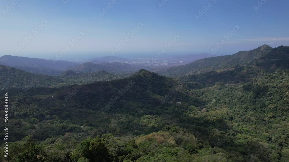 View of Green Mountains Surrounded by Trees and Crops on a Slightly Cloudy Day in the Morning View of Green Mountains Surrounded by Trees and Crops on a Slightly Cloudy Day in the Morning