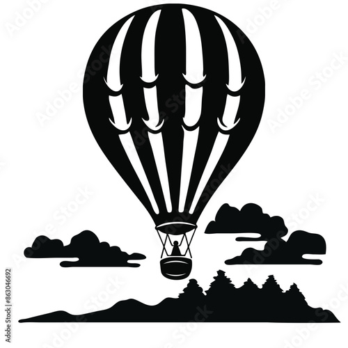 A black and white silhouette of a hot air balloon floating above a landscape with mountains and clouds