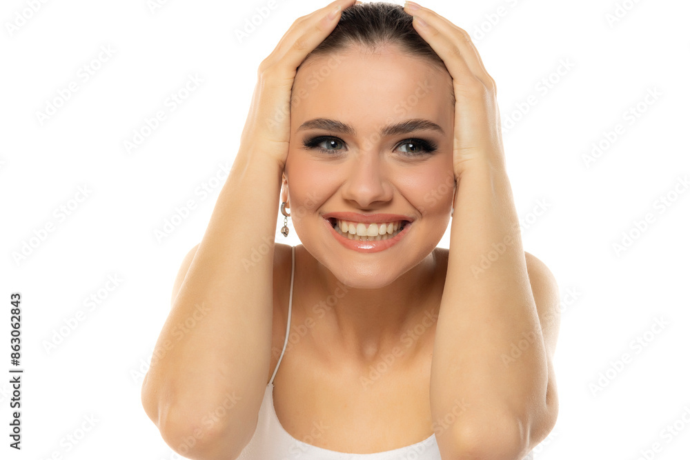 portrait of a young happy teenage girl witht makeup and tied hair on a white background portrait of a young happy teenage girl witht makeup and tied hair on a white background
