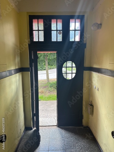 entrance of an old house with a wooden door and windows