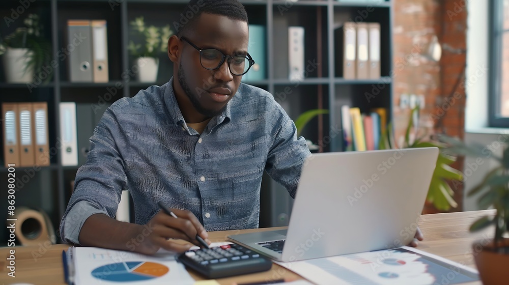 Male accountant calculates companys financial performance using calculator and laptop software Serious millennial man sitting at desk at his workplace in office Business finance accoun : Generative AI Male accountant calculates companys financial performance using calculator and laptop software Serious millennial man sitting at desk at his workplace in office Business finance accoun : Generative AI