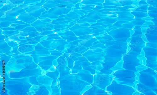 surface of blue swimming pool, background of water in swimming pool. © nata777_7