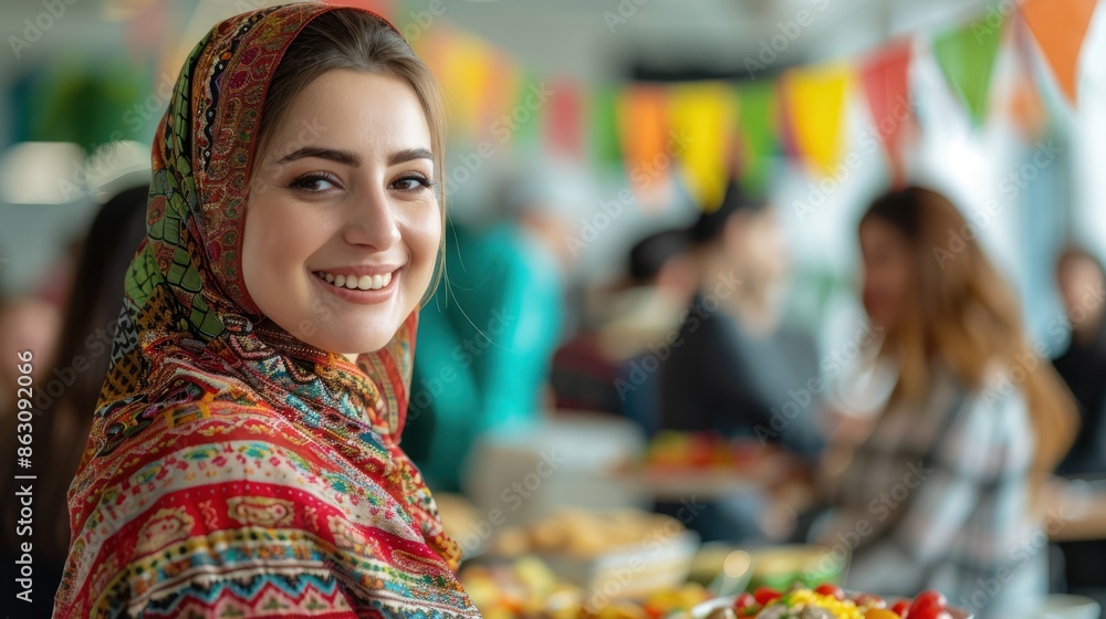 Smiling woman in colorful hijab at a lively community event with flags and blurred people in the background. Smiling woman in colorful hijab at a lively community event with flags and blurred people in the background.