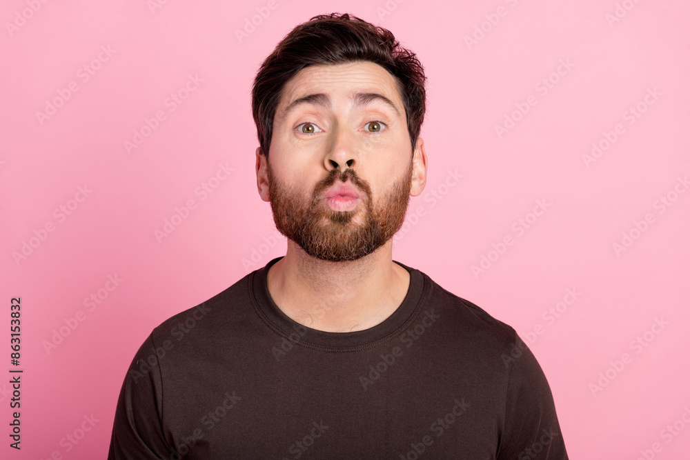 Portrait of flirty good mood man with bristle stylish hairdo wear brown shirt send air kiss pouted lips isolated on pink color background Portrait of flirty good mood man with bristle stylish hairdo wear brown shirt send air kiss pouted lips isolated on pink color background