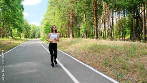 Wallpaper Mural Sport and traumas concept. Young women jogger running and feeling acute pain in knee, massaging painful leg during morning run in park, close up, slow motion Torontodigital.ca